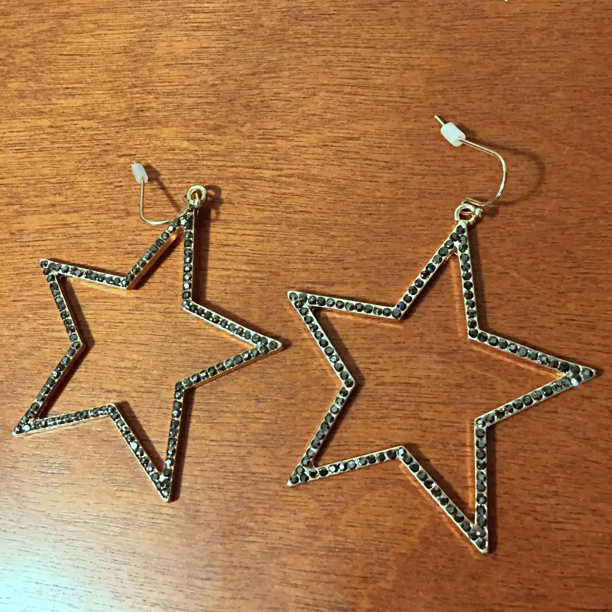 gold star earrings with black rhinestones