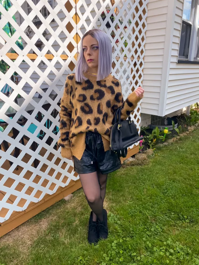 leopard sweater with leather shorts outfit