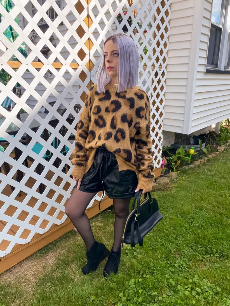 leopard sweater with leather shorts outfit