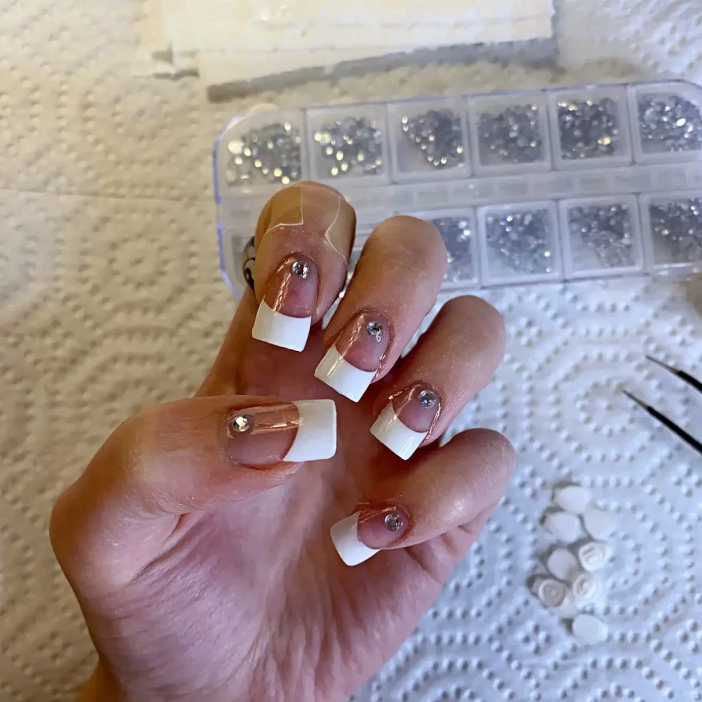 glueing gems onto nails