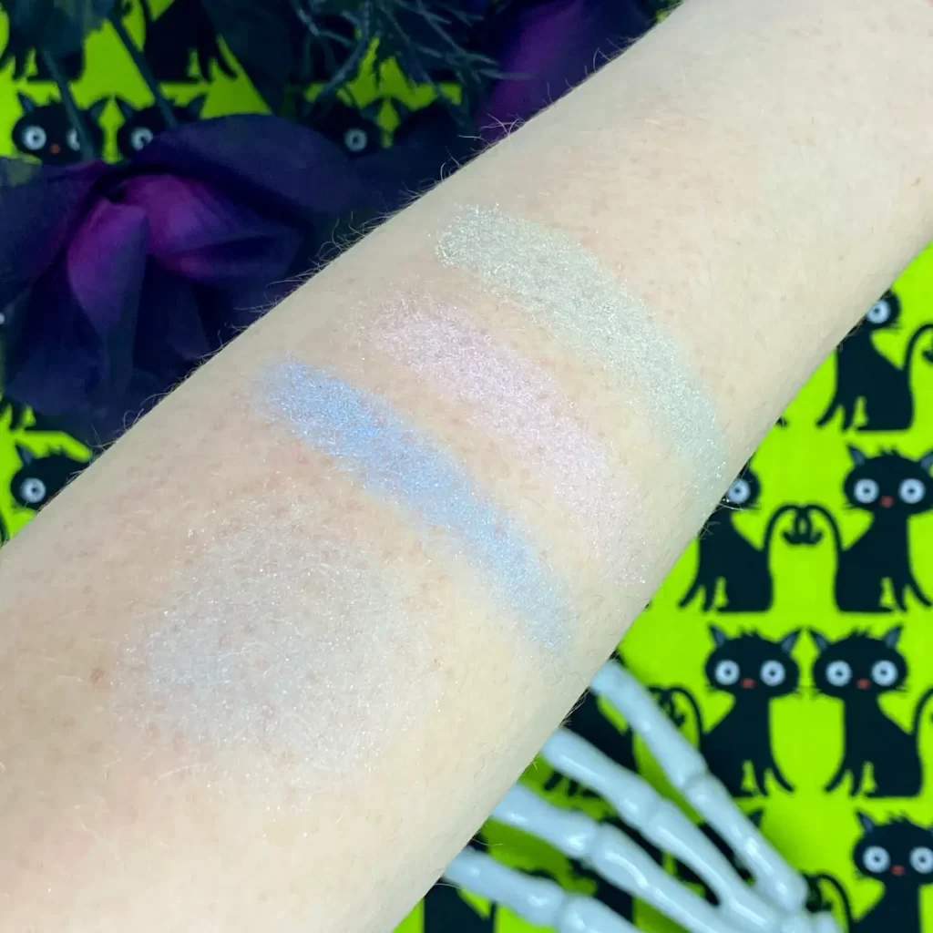 wet n wild fantasy makers trio highlighter cosmic dust swatches