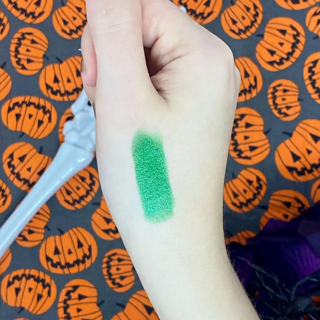 wet n wild fantasy makers glitter lipstick poison ivy swatch