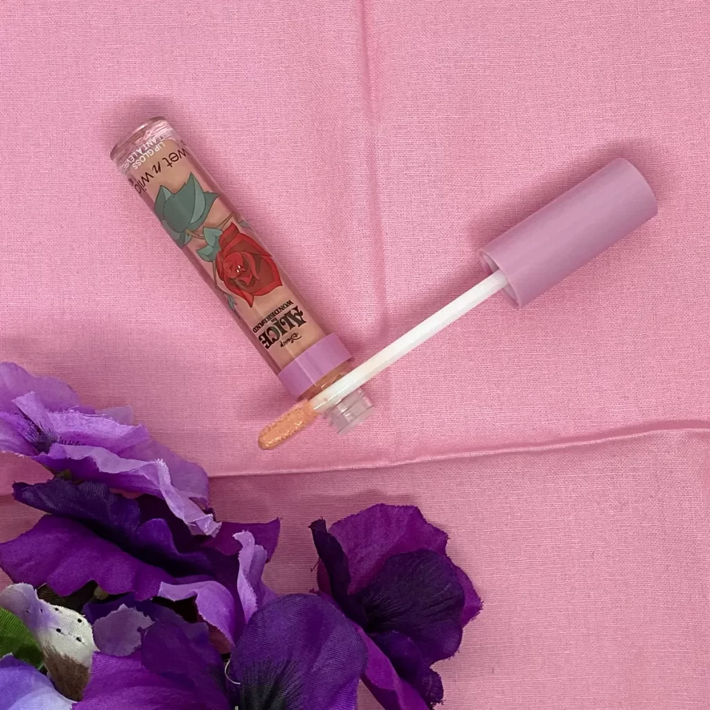 wet n wild Alice in Wonderland Lip Gloss we sing too